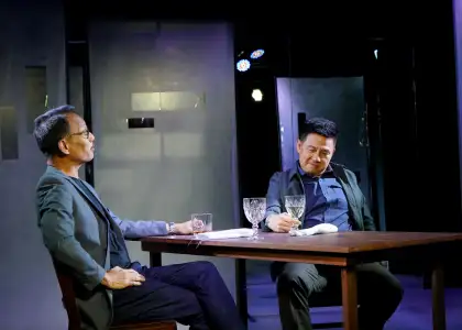 Two men sharing a drink