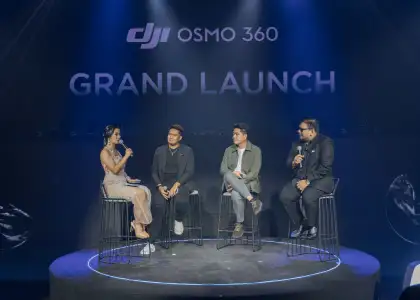 A host and three content creators talking on stage