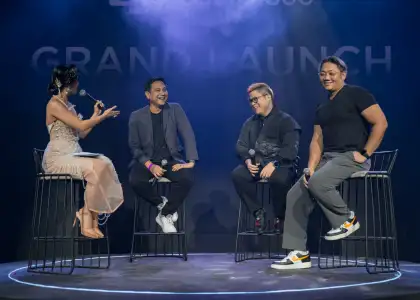 A host and three content creators talking on stage