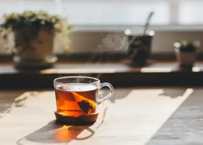 A tea cup by the window with sunlight