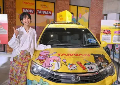 Illustrator Jayee Lim and her design of the campaign's ride-hailing car