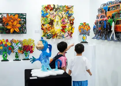 Two children looking at art