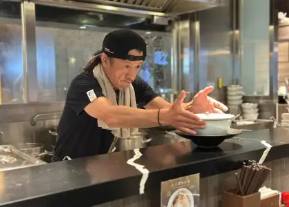 Chef Atsushi Yamamoto presenting a ramen