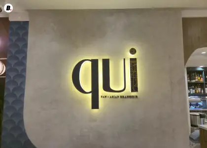 A close up to the logo of Qui Pan Asian Brasserie