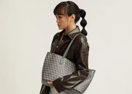 A photo of Christy Ng showcasing the new colorways of her bags