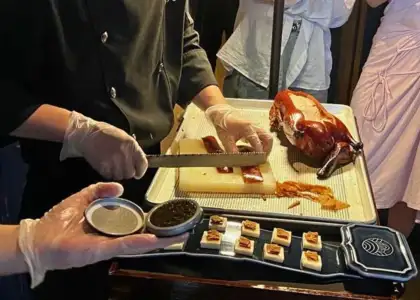 Servers preparing Peking duck with caviar at Tidu Reserve Restaurant in Shanghai as photographed by The Beat Asia