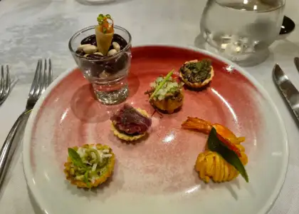 Six different canapes arranged on a plate