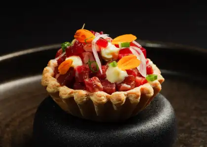 The beef tartare on top of a crumbly pastry cup