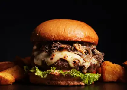 A truffle burger with a brioche bun and truffle flavors