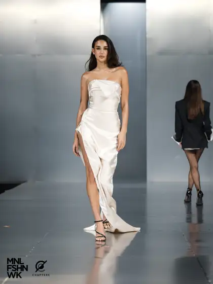 An ivory-cream dress with a high slit