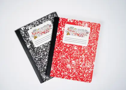 A composition notebook with 2 designs