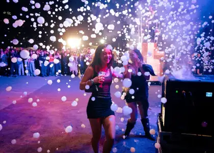 Festival goers playing with bubbles at the Minimax: The Planets performance at Clockenflap