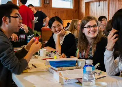 A photo of a group of people meeting up and chatting