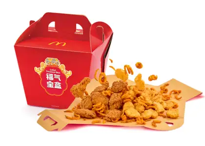 A red box with chicken nuggets, twister fries, and wings