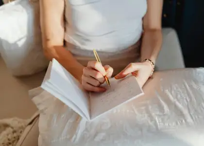 A photo of a woman journaling