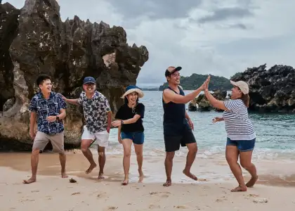 A photo of a group of friends at the beach
