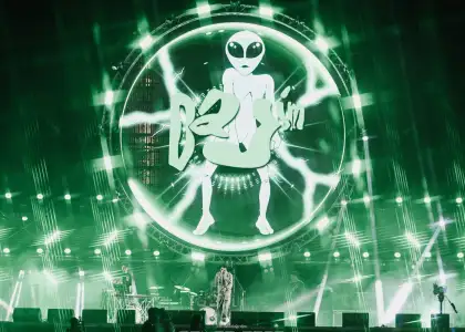 An alien themed background at a music festival