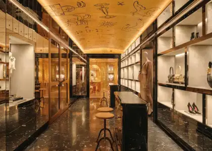 Black and gold interiors with shoes and accesories lining the shelves