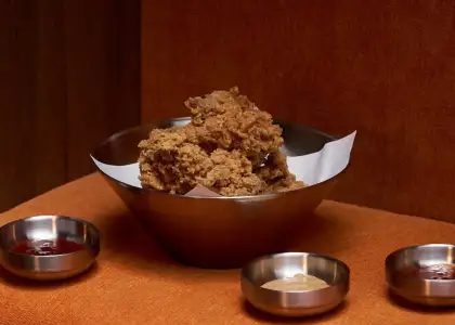 A bowl of Korean fried chicken with sauces