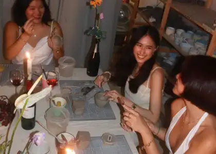 A group of girls in a pottery workshop