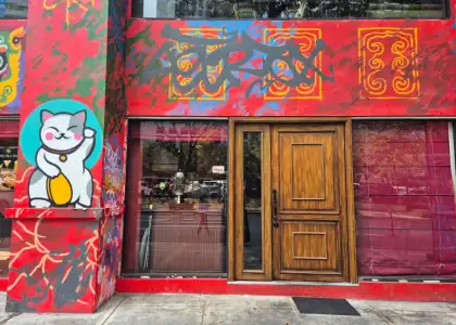 A red building with graffiti