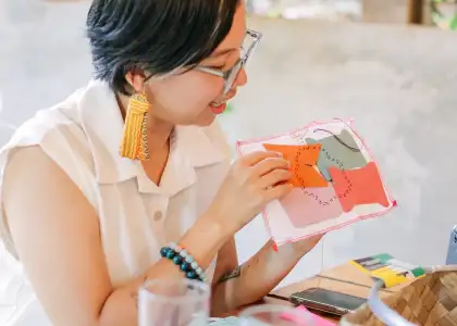 A photo of a woman sewing