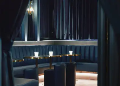 Cool blue booths in a speakeasy