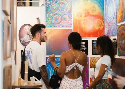 People talking at an art fair