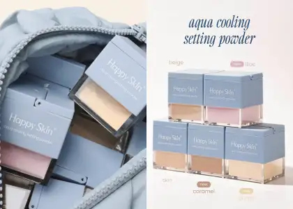 A compact loose setting powder with a light blue top