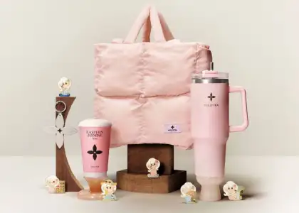 A tote bag, a drink cup, magnets, a big cup in pink tones