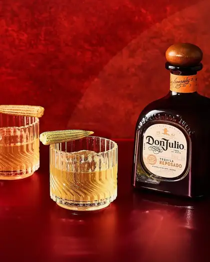 Two short glasses with a bottle of Tequila Don Julio