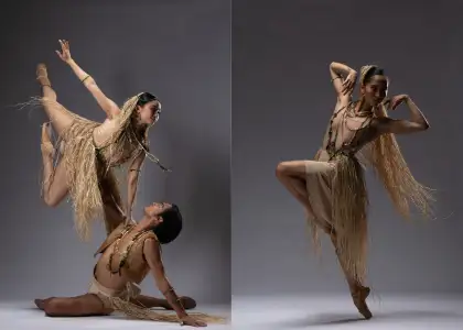 Three ballet dancers: two in a pas de deux, the other in solo