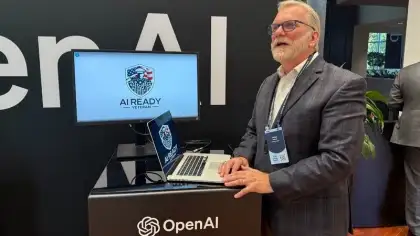 Someone standing an OpenAI booth