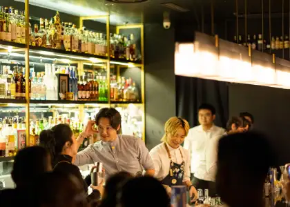 Bartenders and mixologists talking behind the bar