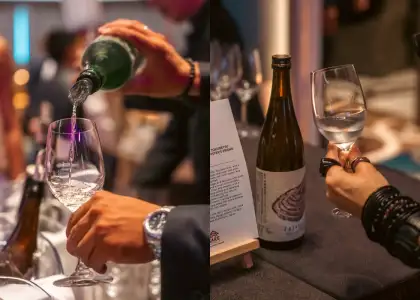 Japanese bottles of liquor being poured