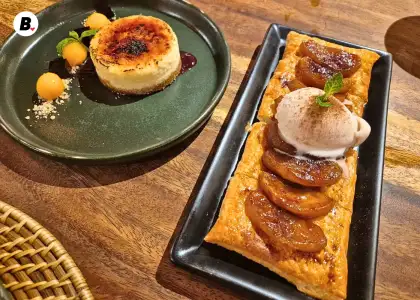 Two desserts: a cheesecake and a puff pastry with apples