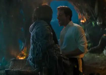 Still from 2025 film Wicked: For Good featuring co-stars Cynthia Erivo in an oversized cardigan and Jonathan Bailey