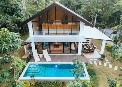 A modern and stylish guest house with a pool