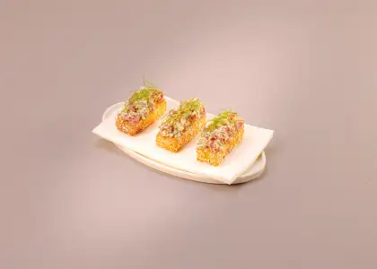 Finger food inspired by East Asia with a beige backdrop