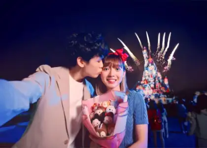 Couple kisses in front of Hong Kong Disneyland fireworks show for best proposal spots in Hong Kong
