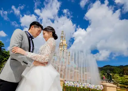 Couple kisses in front of Hong Kong Disneyland castle for best proposal spots in Hong Kong