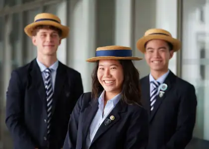 Students in uniform smiling and posing at Harrow International School - best Hong Kong International Schools - The Beat Asia