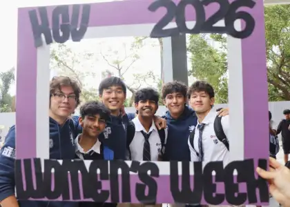 Students smiling and posing behind Women's Week 2026 frame at KGV School - best Hong Kong International Schools - The Beat Asia