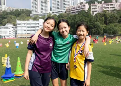 Students smiling and posting at Sports Day at Victoria Shanghai Academy - best Hong Kong International Schools - The Beat Asia