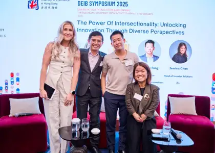 Emery Fung posing with guests at the DEIB Symposium 2025