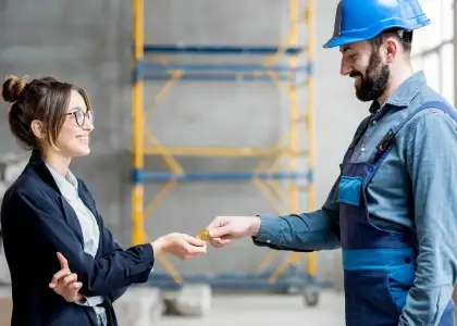 Woman giving cryptocurrency to a builder 2021 12 13 22 44 07 utc