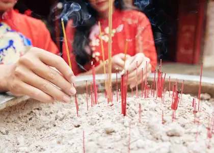 Putting smoking sticks in copper urn 2023 11 27 05 13 33 utc 1