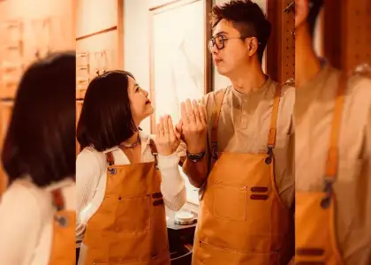 Couple showing rings at a jewellery-making workshop