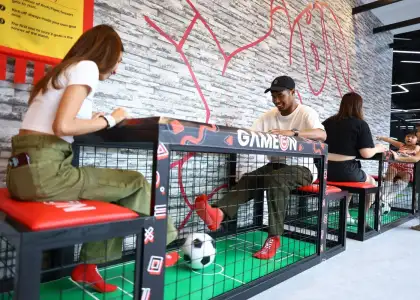 People playing a football game at Game On Sports Hub