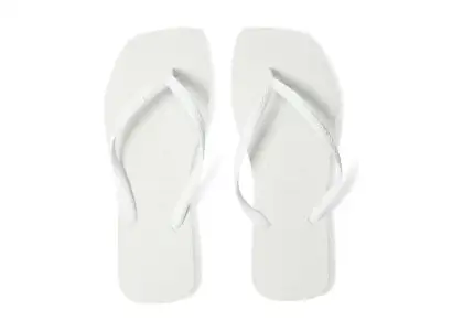 A woman perched on the side of a boat